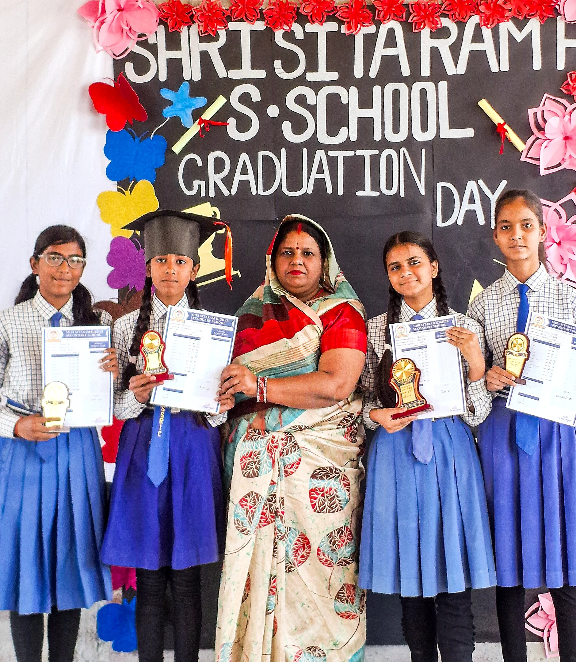 Students celebrating achievement on graduation day