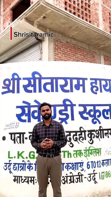 A school representative speaking beside the Shri Sitaram campus sign