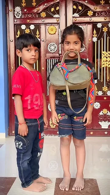 Two young Shri Sitaram learners in costume during a school performance